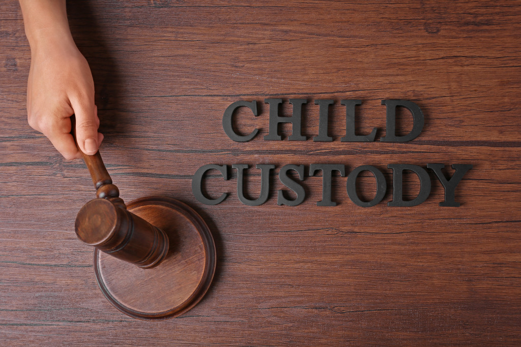 Child custody concept, a hand holding a gravel