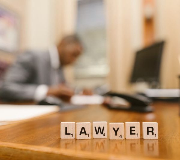 a silhouette of a lawyer working on his desk