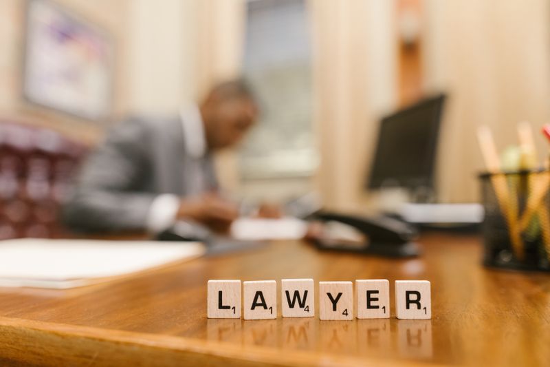 a silhouette of a lawyer working on his desk